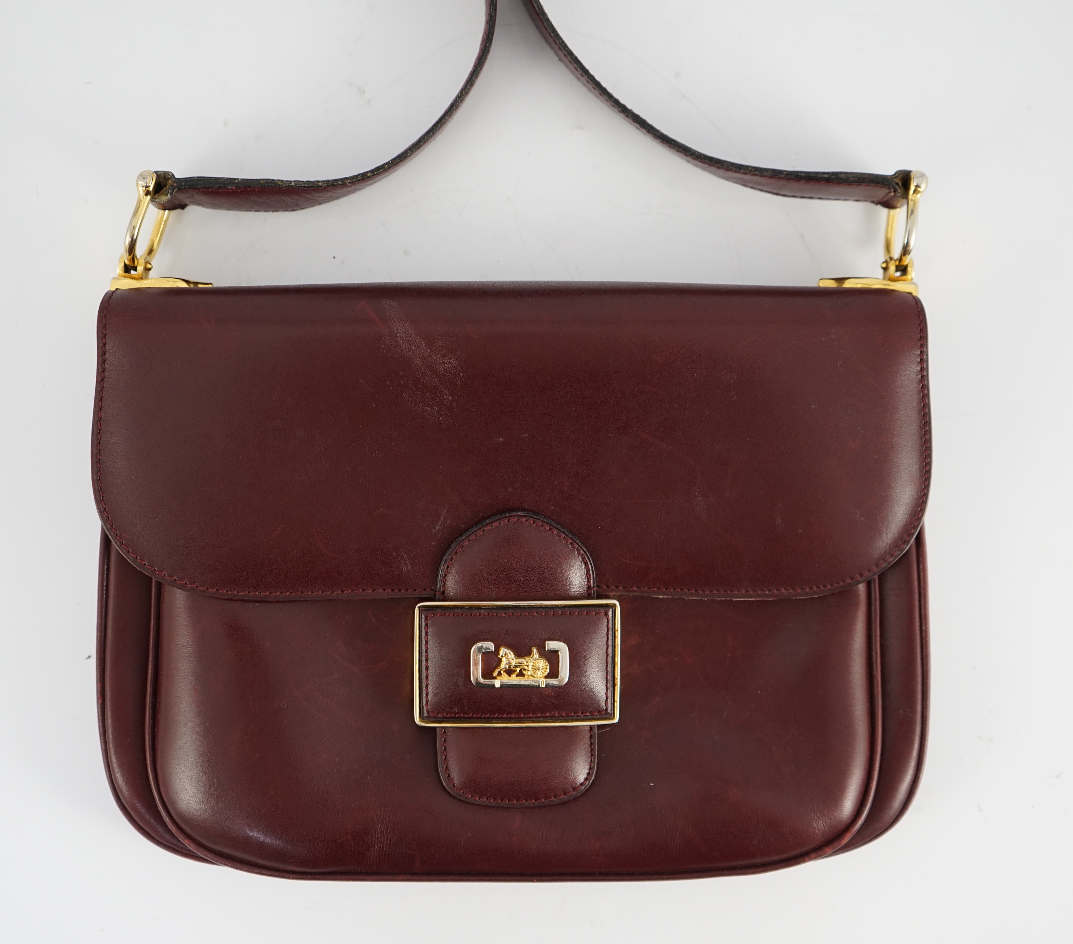 A vintage Celine horse carriage cargo flap burgundy leather shoulder bag, width 26cm, depth 3cm, height 18.5cm